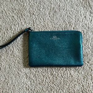 Blue metallic colored coach wristlet